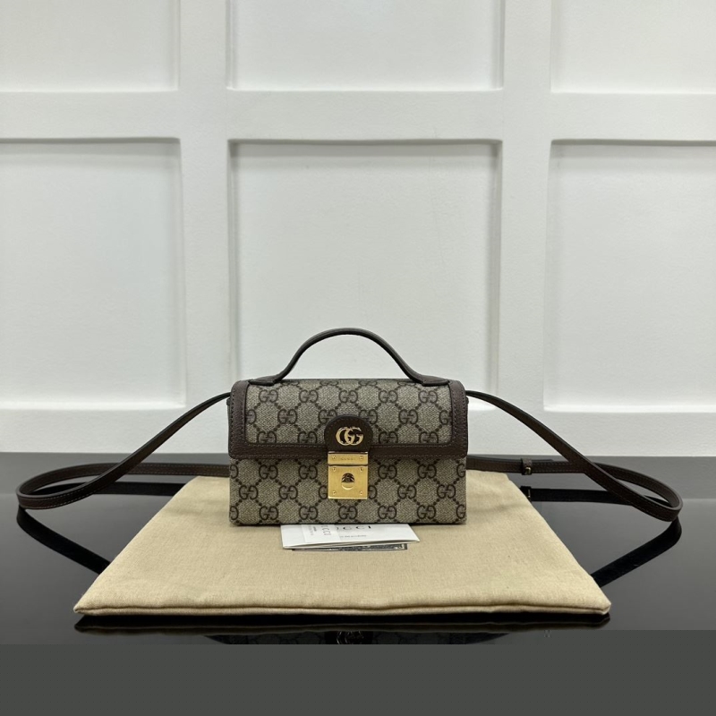 G*u*i top handle bags